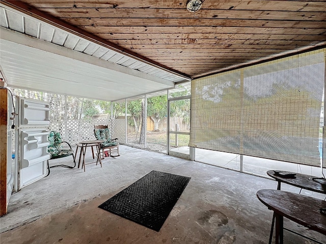 unfurnished sunroom with wood ceiling