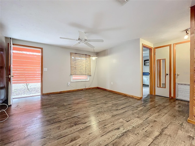 spare room featuring ceiling fan and wood-type flooring