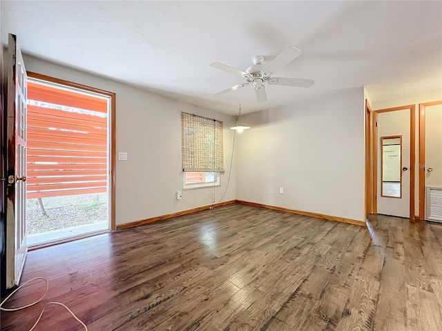 unfurnished room with ceiling fan and hardwood / wood-style flooring