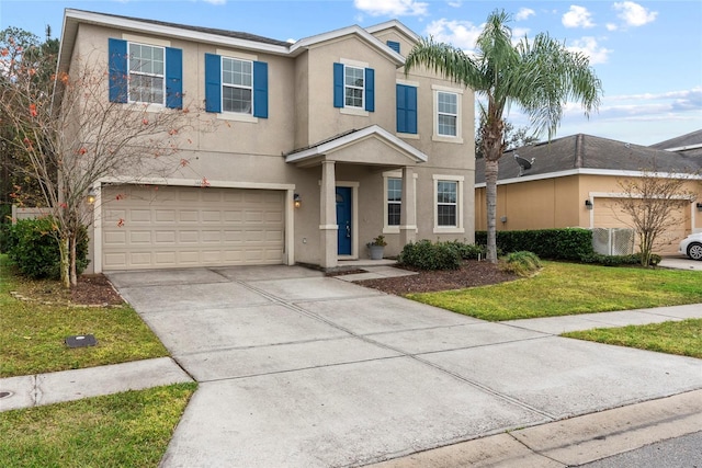 view of front facade with a front yard and a garage