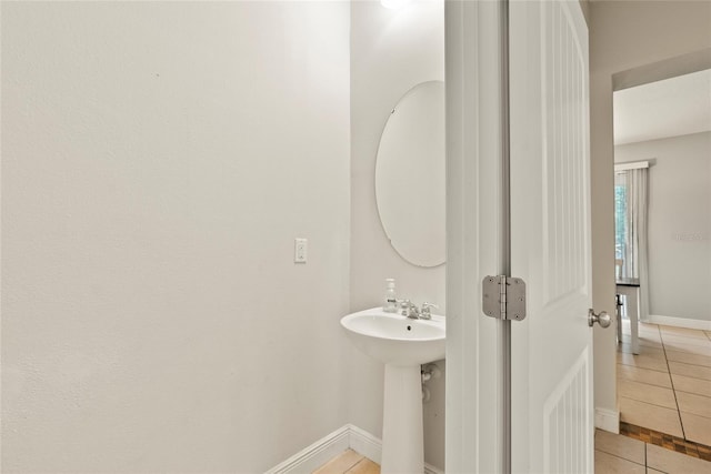 bathroom with tile patterned floors