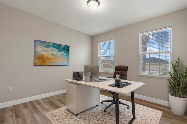 office space with light hardwood / wood-style flooring