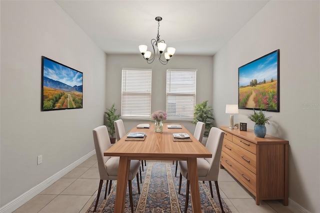 dining space with a chandelier and light tile patterned flooring