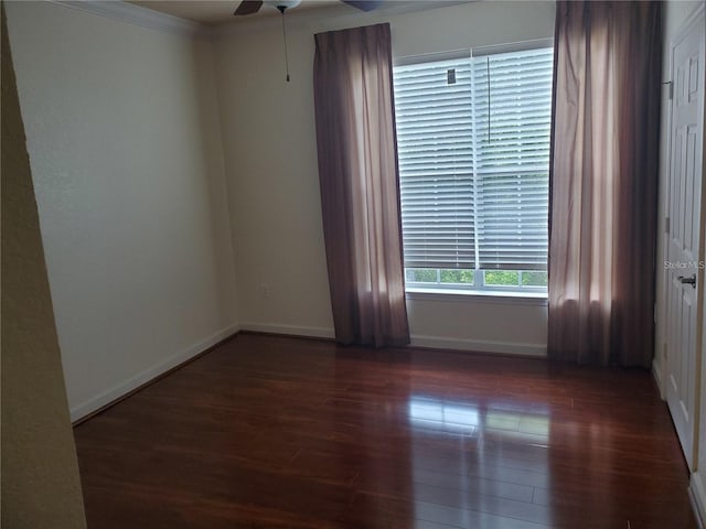 spare room featuring ceiling fan, dark hardwood / wood-style floors, and ornamental molding