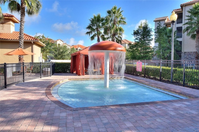 view of pool with pool water feature