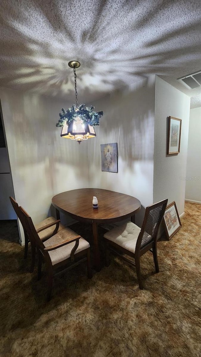 dining room featuring breakfast area and carpet