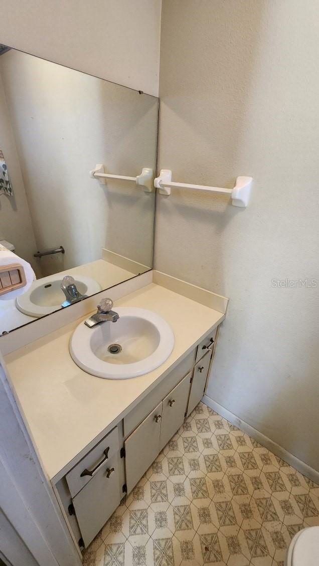 bathroom with vanity and toilet