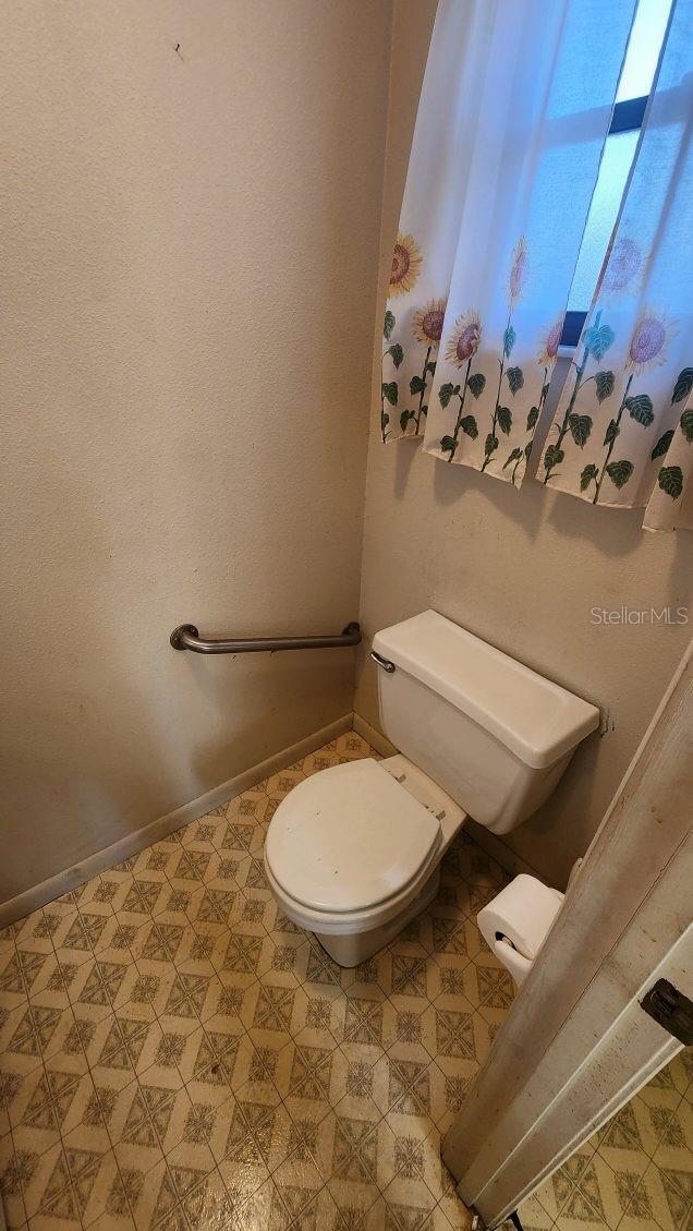 bathroom featuring toilet