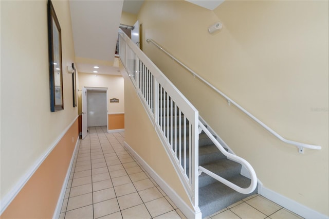 staircase with tile patterned flooring