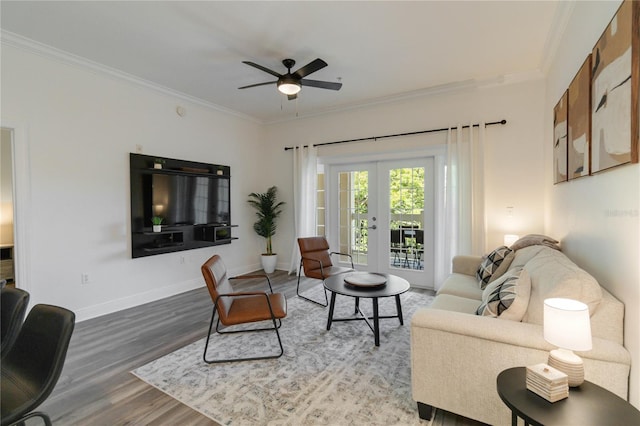 living room featuring hardwood / wood-style flooring, crown molding, ceiling fan, and french doors