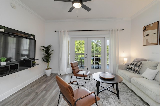 living room featuring ornamental molding, hardwood / wood-style floors, ceiling fan, and french doors