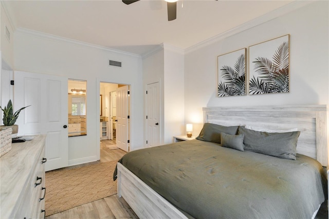 bedroom featuring ceiling fan, ensuite bath, ornamental molding, and light hardwood / wood-style flooring