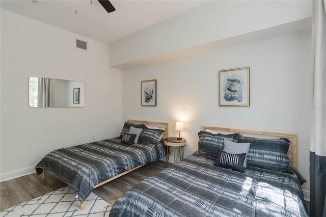 bedroom featuring ceiling fan and wood-type flooring