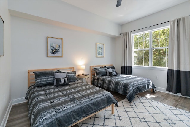 bedroom featuring hardwood / wood-style flooring and ceiling fan