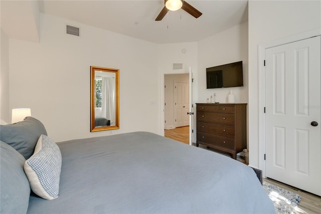 bedroom with ceiling fan and light hardwood / wood-style floors