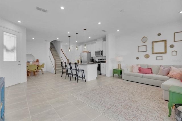 living room with light tile patterned floors