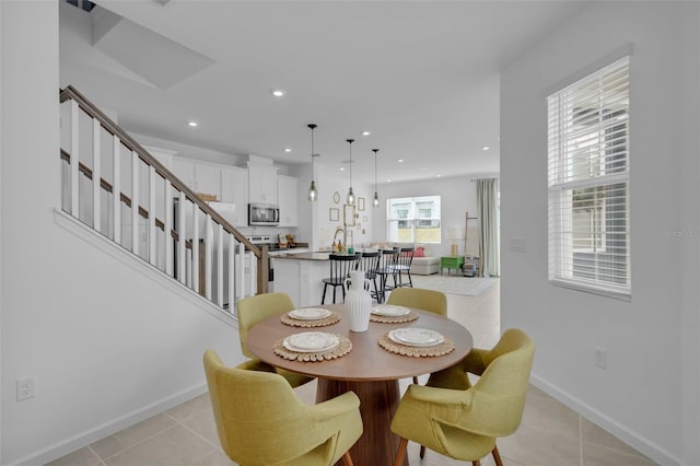 dining area with light tile patterned floors