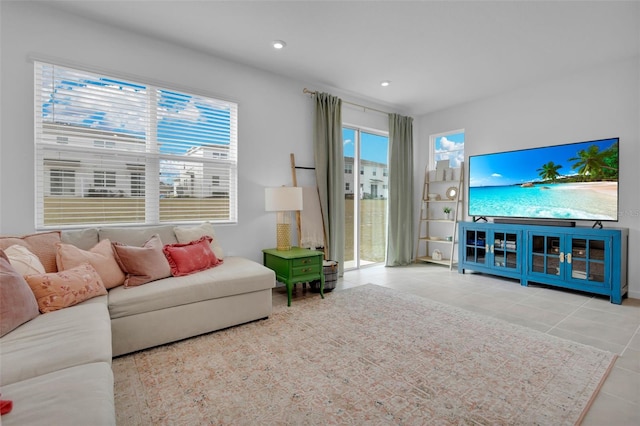 tiled living room featuring a wealth of natural light