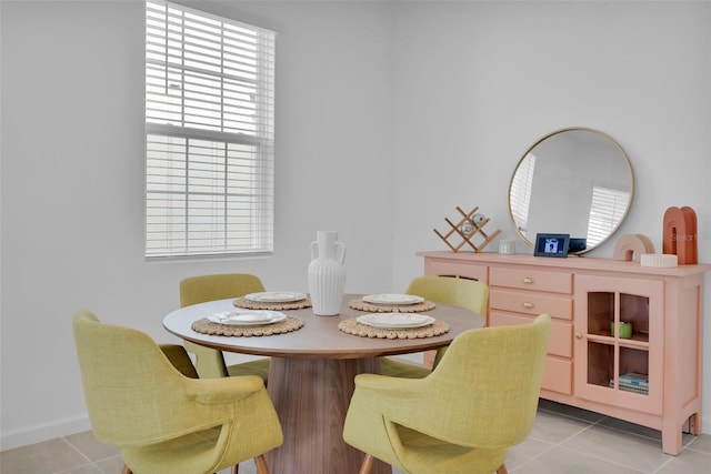 dining room featuring light tile patterned floors and plenty of natural light