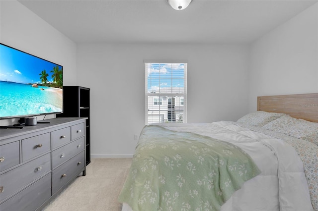 bedroom featuring light colored carpet