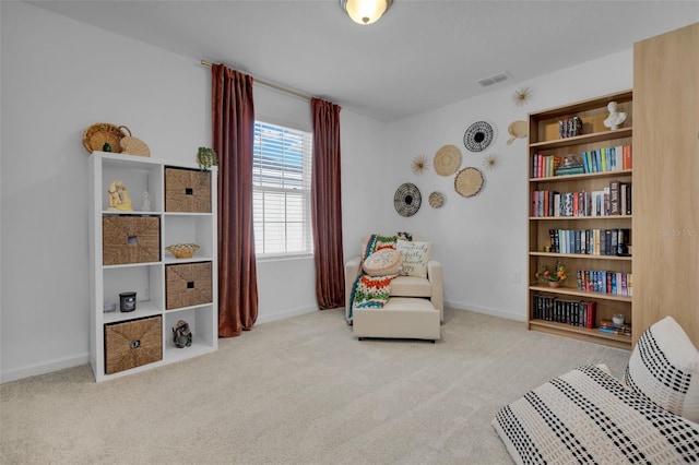 living area featuring light colored carpet