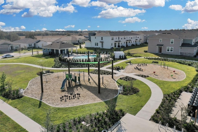 view of community featuring a yard and a playground