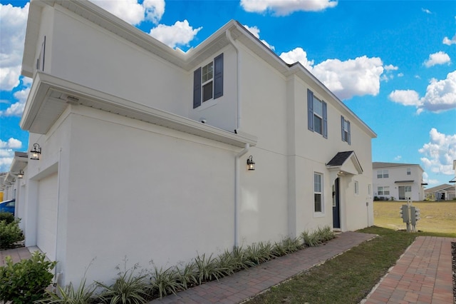 view of property exterior with a garage