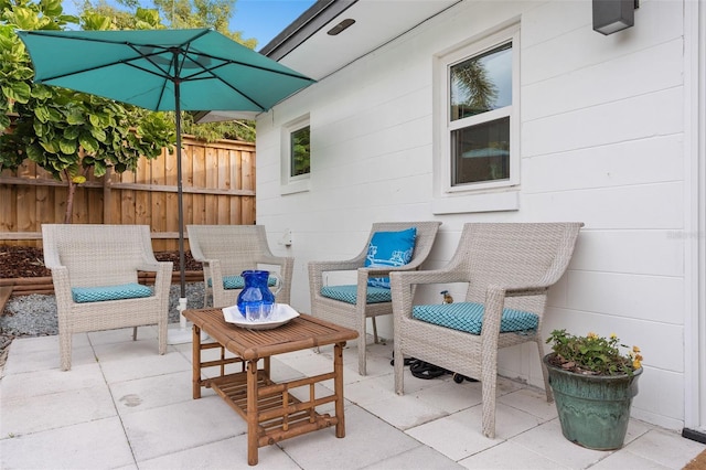 view of patio / terrace featuring fence