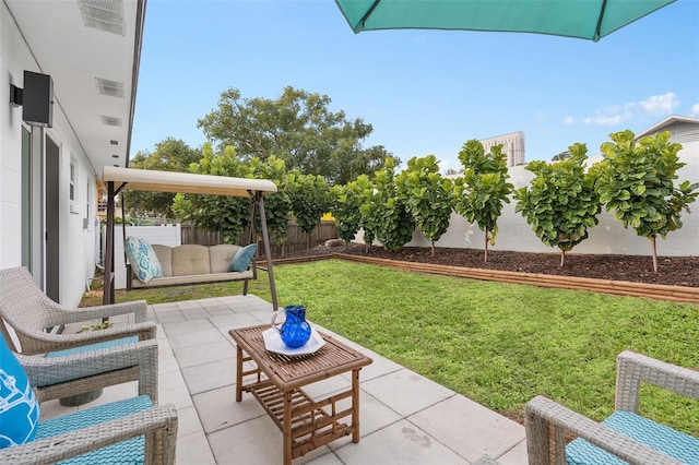 view of yard featuring a fenced backyard, outdoor lounge area, and a patio