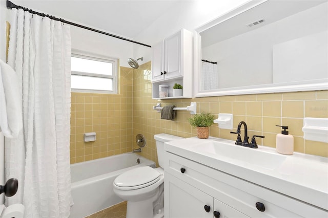 full bathroom with tile walls, decorative backsplash, vanity, toilet, and shower / bathtub combination with curtain