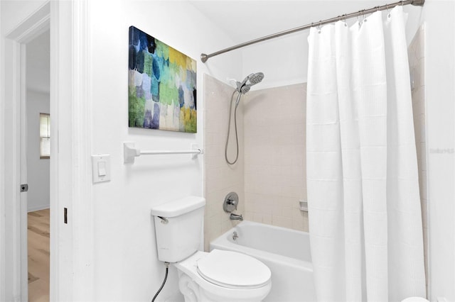 bathroom featuring toilet, shower / tub combo, and hardwood / wood-style floors