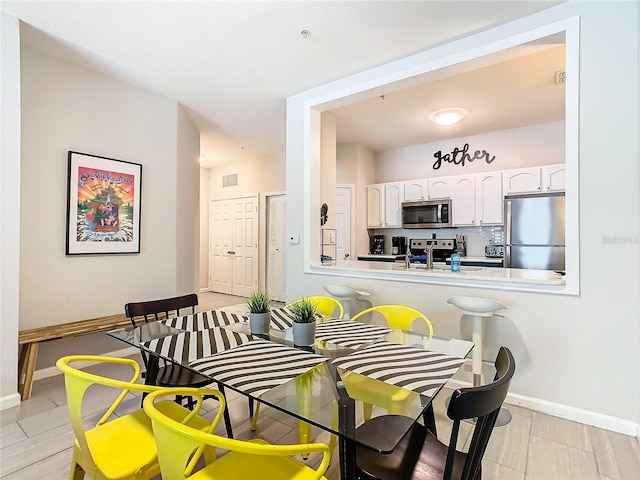 dining space with sink