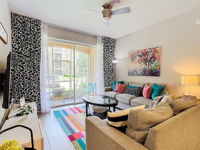 tiled living room with ceiling fan