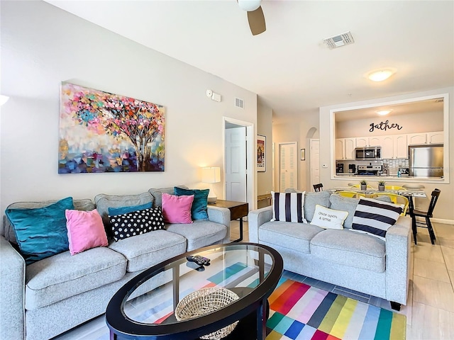 living room featuring ceiling fan