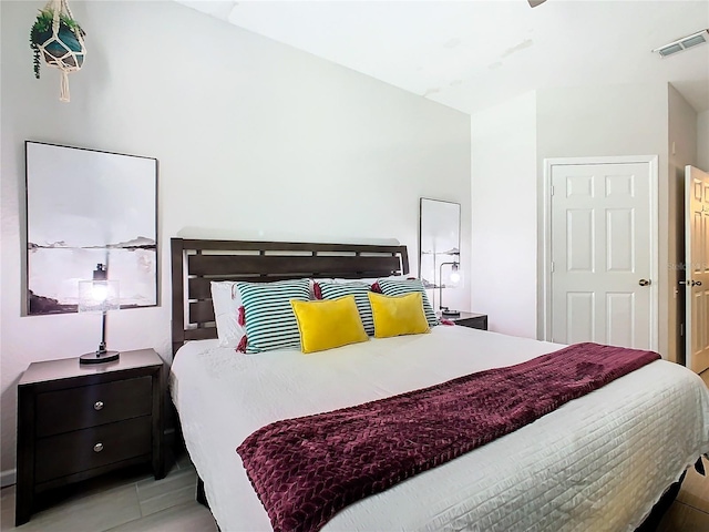 bedroom featuring light tile patterned flooring