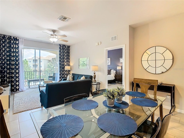 tiled dining area with ceiling fan