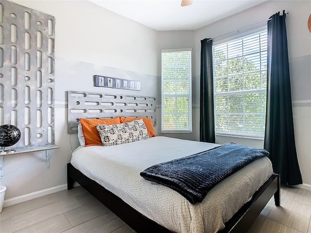 bedroom featuring ceiling fan and light wood-type flooring