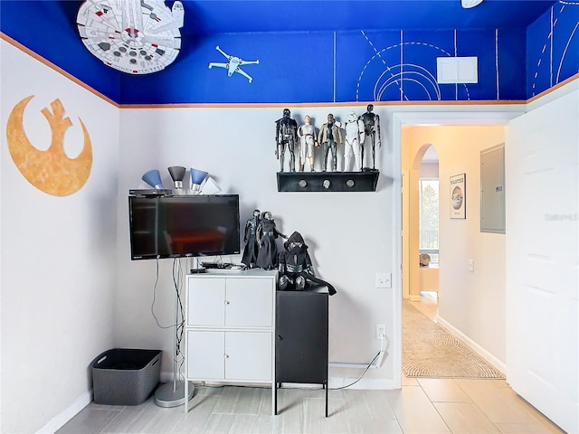 interior space featuring electric panel and tile patterned flooring