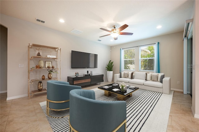 living room featuring light tile patterned floors and ceiling fan