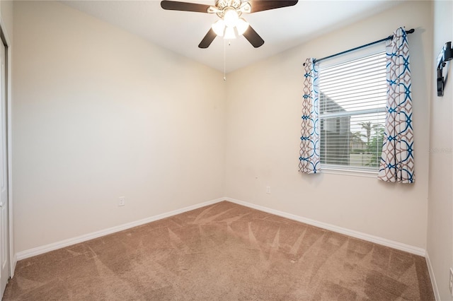 carpeted empty room with ceiling fan