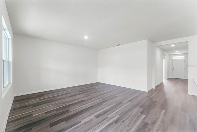 empty room featuring dark hardwood / wood-style floors