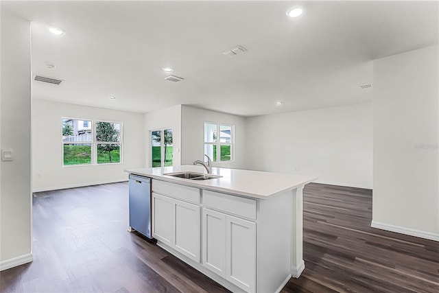 kitchen with dishwasher, white cabinetry, dark hardwood / wood-style flooring, sink, and a center island with sink