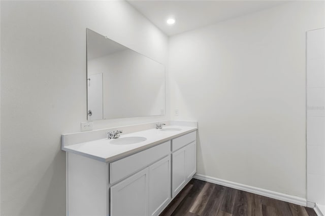 bathroom with vanity and hardwood / wood-style floors