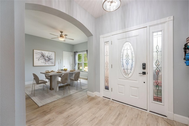 foyer entrance with light wood-type flooring and ceiling fan