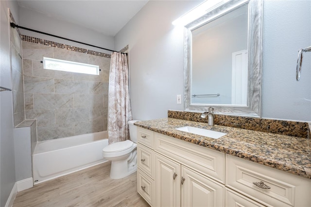 full bathroom featuring vanity, toilet, hardwood / wood-style floors, and shower / bath combo