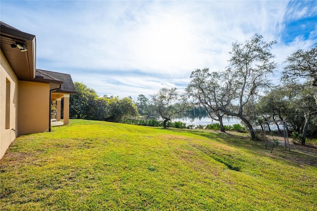 view of yard with a water view