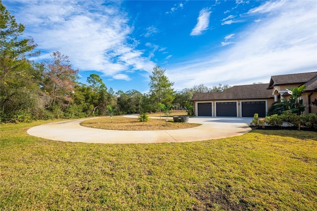 view of front of home with a garage and a front yard