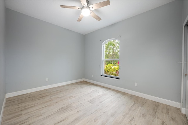 unfurnished room with ceiling fan and light hardwood / wood-style flooring