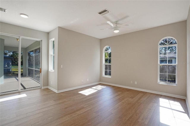 spare room with ceiling fan and light hardwood / wood-style flooring