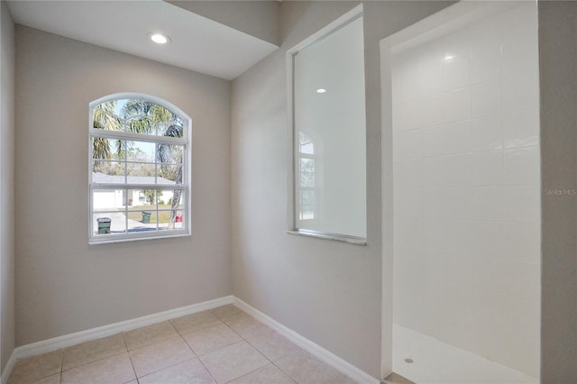 unfurnished room with light tile patterned floors